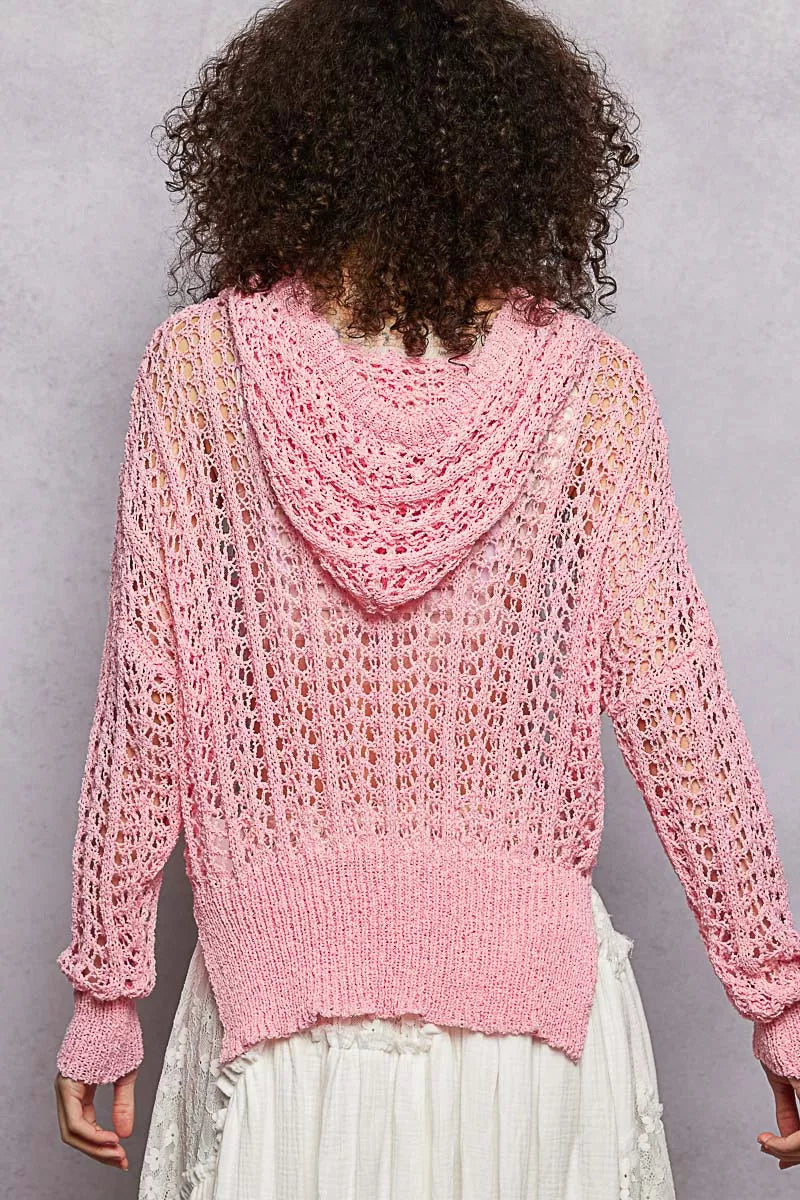Pink openwork knit top with hooded cowl back and long sleeves