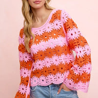 Crochet knit top with orange and pink floral pattern, long sleeves, scoop neck.