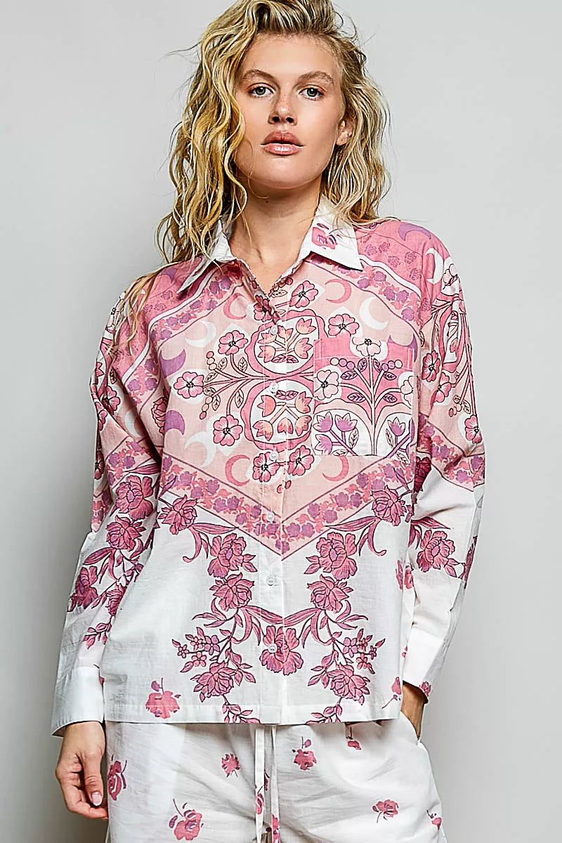 Floral button-down shirt with pink and burgundy print on ivory base, collared front