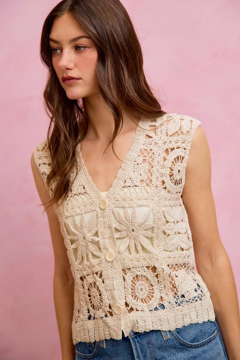 Natural crochet sleeveless vest top with V-neck, button front, and openwork floral motifs