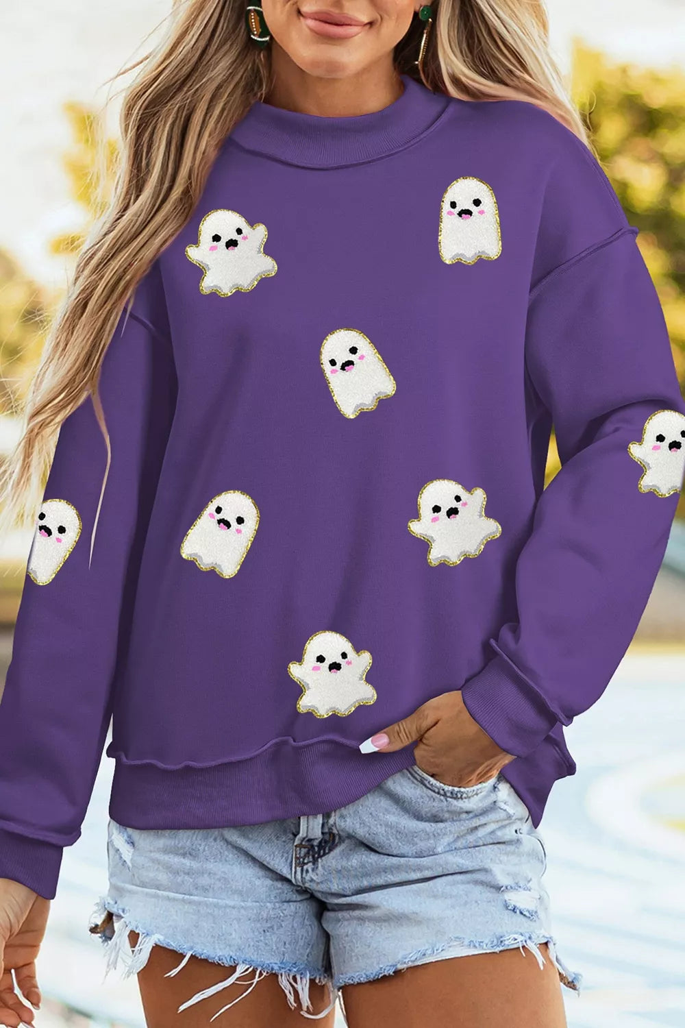 Purple mock neck tunic sweatshirt with scattered ghost print and long sleeves