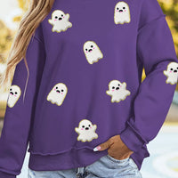Purple mock neck tunic sweatshirt with scattered ghost print and long sleeves