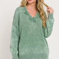 Green washed oversized V-neck sweater with long sleeves and ribbed trim at neckline