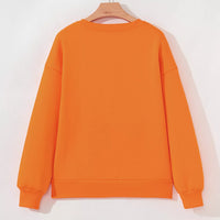 Orange Halloween crewneck sweatshirt back view on hanger, plain rear