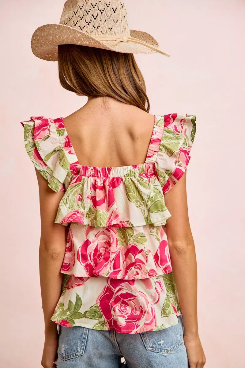 Back view of floral ruffle square-neck top with tiered ruffles and pink-green rose print