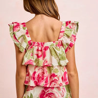 Back view of floral ruffle square-neck top with tiered ruffles and pink-green rose print
