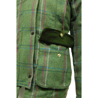 Green plaid tweed jacket detail showing a flap pocket and adjustable side tab