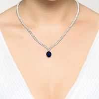Silver tennis necklace with oval sapphire pendant