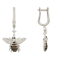 Silver bee drop earrings shown side view with hooked clasp and dangling charm