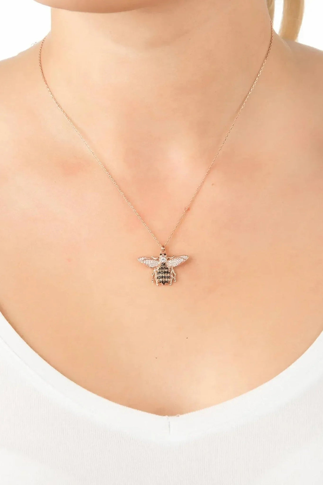 Silver bee pendant necklace with small rhinestone honeycomb-style bee on thin chain