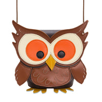 Brown owl leather bag with orange eyes, cream patches, and stitched beak
