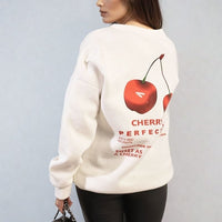 White oversized knitted jumper with large back cherry graphic and text design