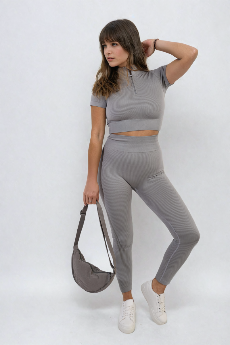 Grey ribbed half-zip crop top and high-waist leggings set, full-body standing