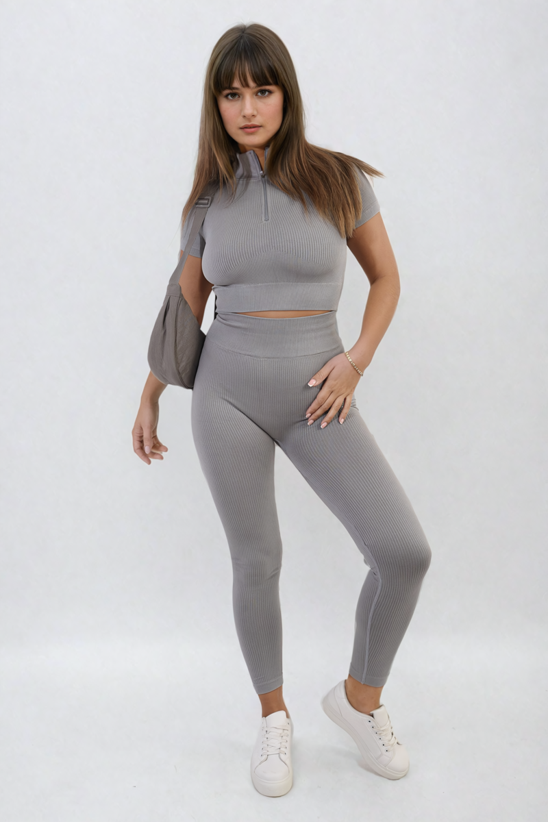 Grey ribbed half-zip crop top and high-waist leggings set, standing front pose