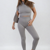 Grey ribbed half-zip crop top and high-waist leggings set, standing front pose