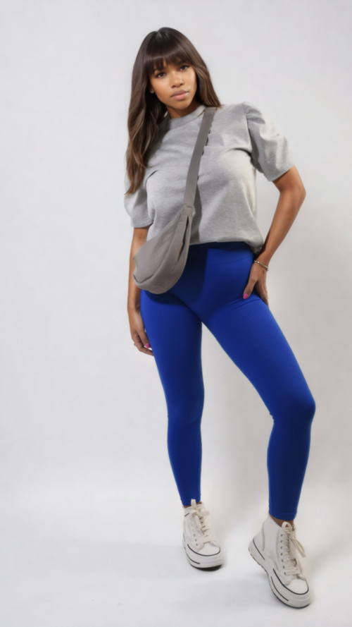 High-waisted royal blue leggings with wide waistband, ankle-length, front stance