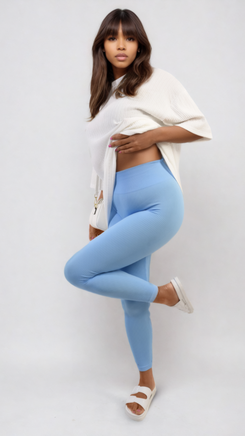 High-waisted light blue leggings with wide waistband, ankle-length, knee-bend pose