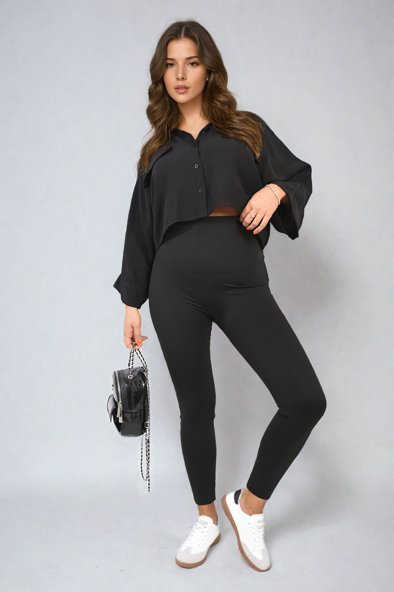 Black high-waisted leggings with fitted legs and smooth waistband, full-length front