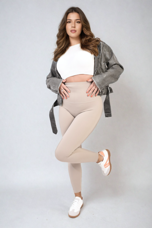 Apricot high-waisted leggings with wide waistband and slim fitted legs, side view