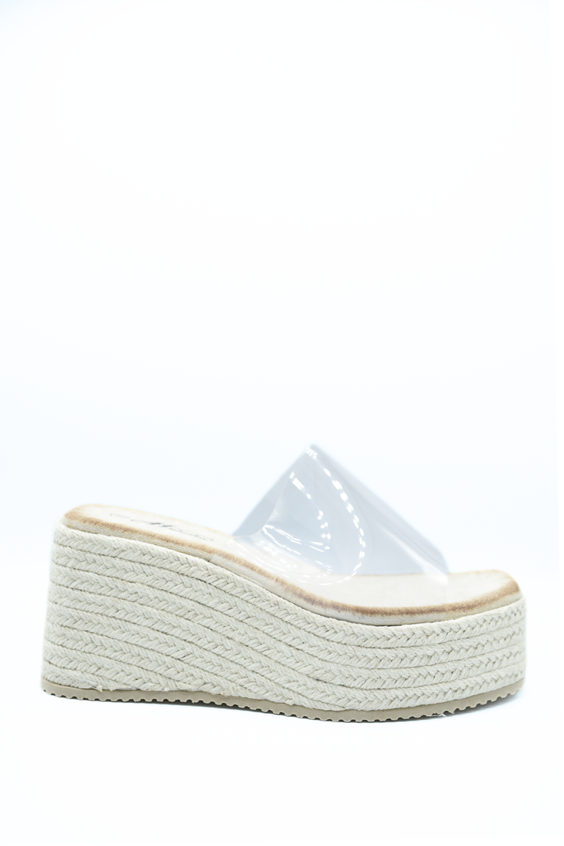 Beige platform wedge slide sandal with clear open top and woven textured sole