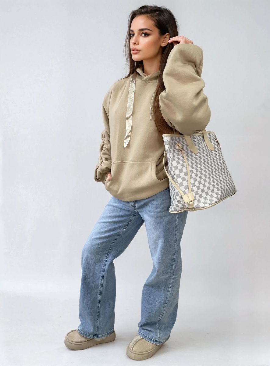 Beige oversized hoodie with ruched sleeves, drawstring hood, and front pouch pocket
