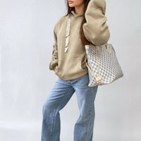 Beige oversized hoodie with ruched sleeves, drawstring hood, and front pouch pocket