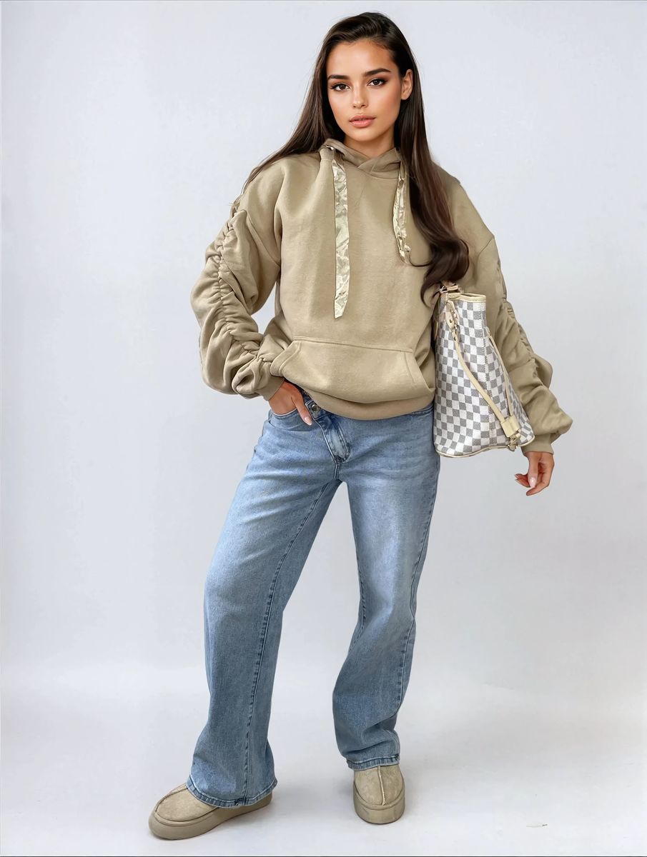 Oversized beige hoodie with ruched sleeves, pouch pocket, and drawstring hood