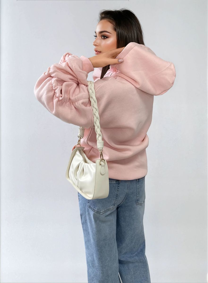 Oversized pink hoodie with ruched sleeves, front pouch pocket, and drawstring hood