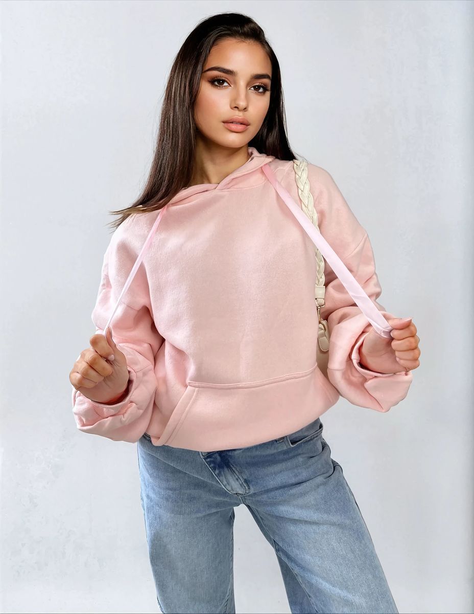 Oversized pink hoodie with ruched sleeves, pouch pocket, and drawstring hood