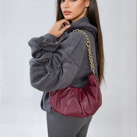 Charcoal oversized hoodie with ruched sleeves, drawstring hood, and front pouch pocket