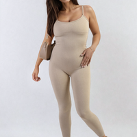 Beige fitted jumpsuit with scoop neck and thin spaghetti straps, full length