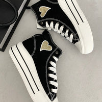 Kids high-top lace-up trainers, black with gold heart patches and white sole