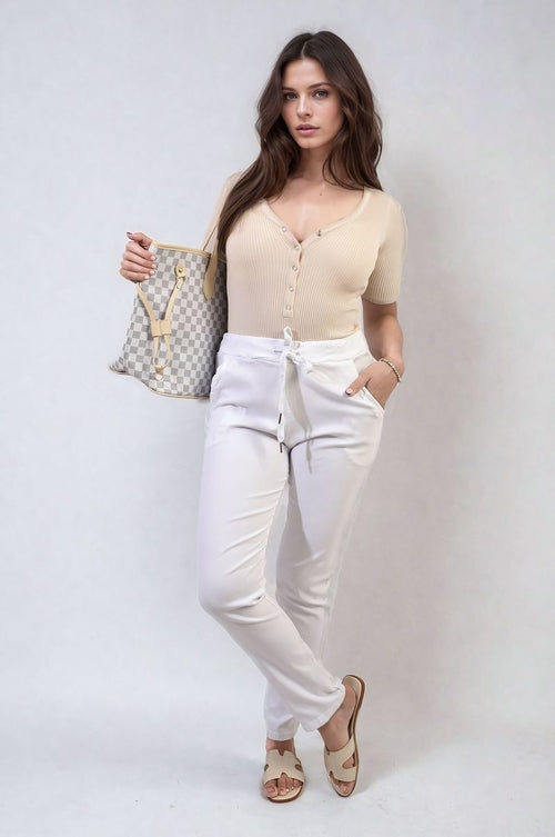 White drawstring tapered trousers with side pockets
