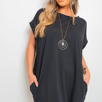 Black short-sleeve tunic top with wide drape silhouette and crew neckline