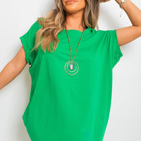 Short-sleeve top with front pockets, vivid green tunic length