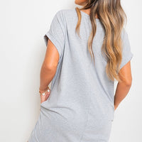 Heather gray short-sleeve tunic top with front pockets, loose oversized fit.