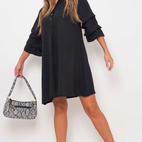 Black shirt dress with V-neck front and loose sleeves, gathered waist, above-knee length