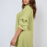 Light olive shirt dress with collar and loose sleeves, side view.