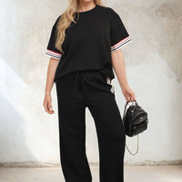 Black short-sleeve top and wide-leg trousers co-ord set with contrast stripe cuff detailing