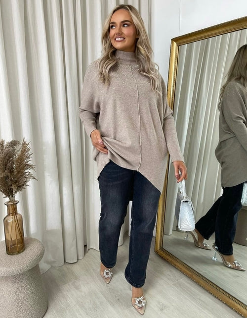 Beige oversized knitted jumper with rhinestone dot detail, relaxed fit and high neck