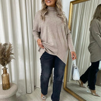 Beige oversized knitted jumper with rhinestone dot detail, relaxed fit and high neck