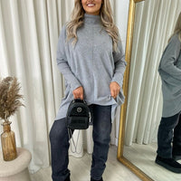 Light grey oversized knitted jumper with rhinestone dot pattern, high neck and long sleeves
