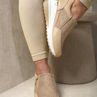 Beige platform trainers with rhinestone front panels and side zip fastening