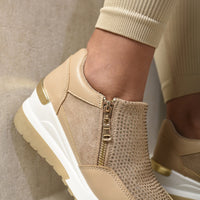Beige platform sneaker with full side zip and rhinestone-textured front