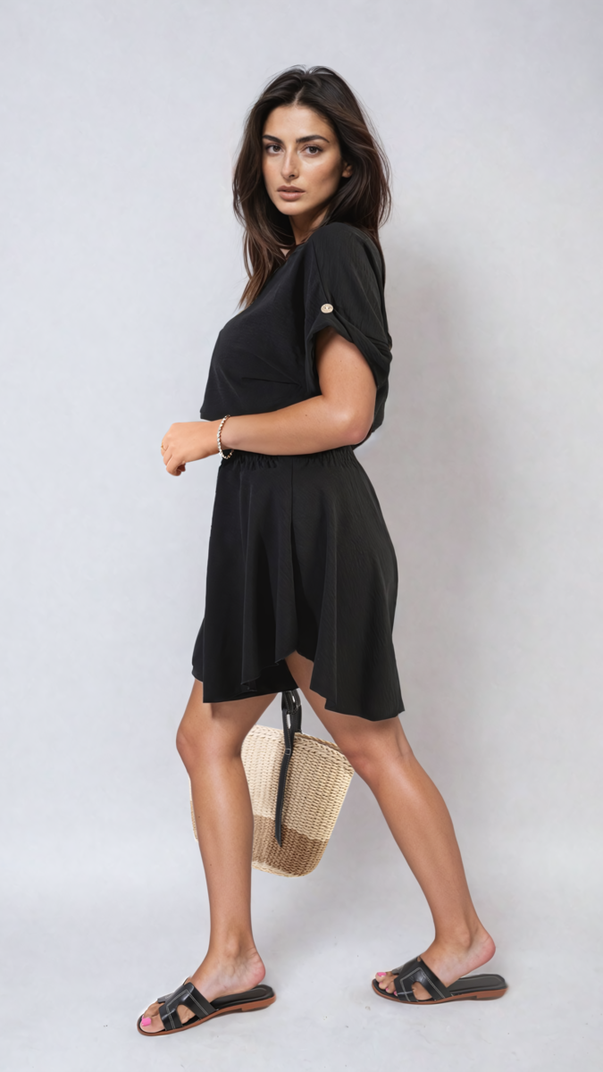Black roll-sleeve top with shirred waist shorts, side view co-ord set