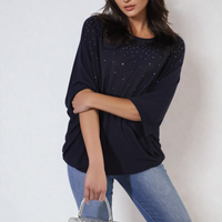 Oversized dark round-neck top with studded speckle detail, draped three-quarter sleeves