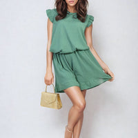 Green ruffle-trim sleeveless top and matching tiered shorts set, full outfit view.