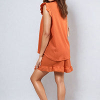 Ruffle-trim sleeve top and shorts set in orange, side profile