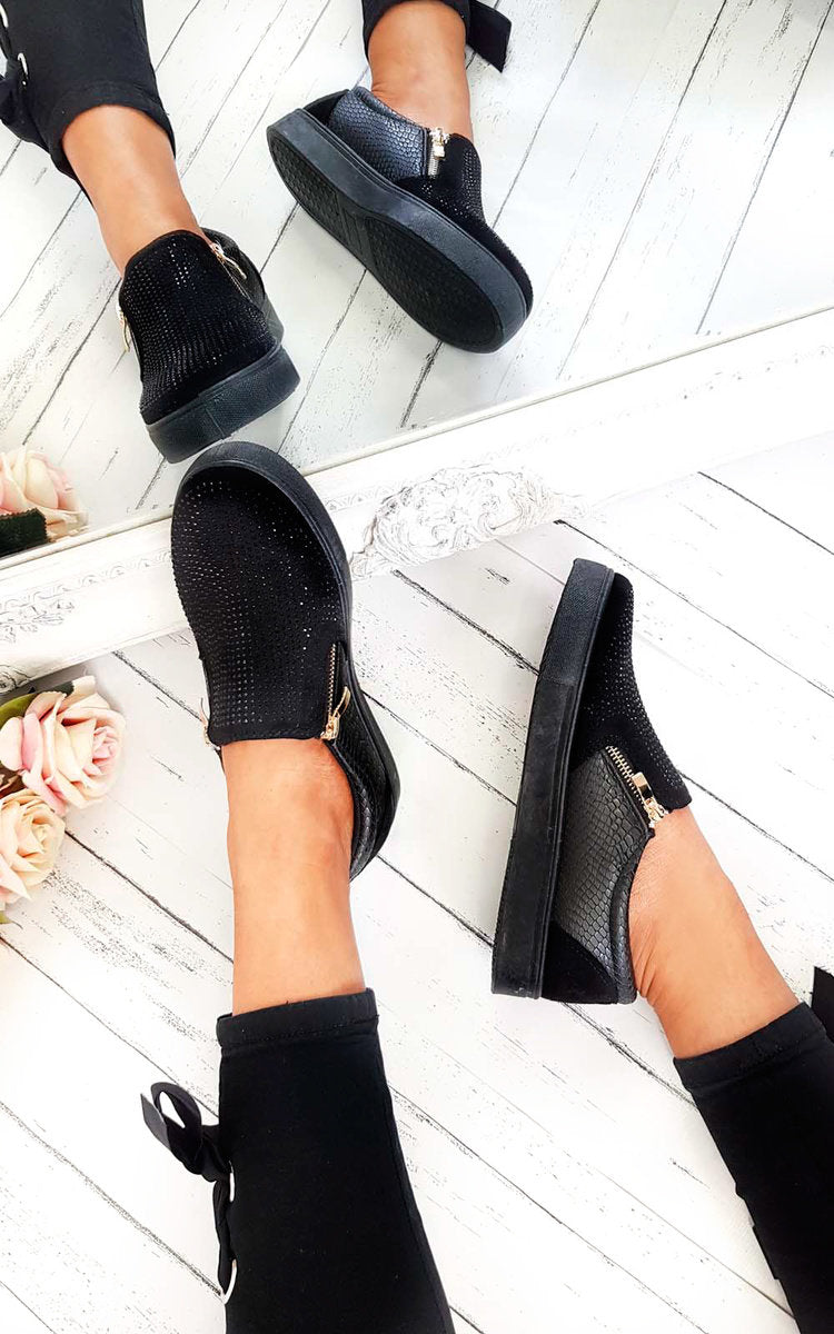 Black slip-on trainer pair with rhinestone-dotted upper, croc-effect panel, gold zip detail.