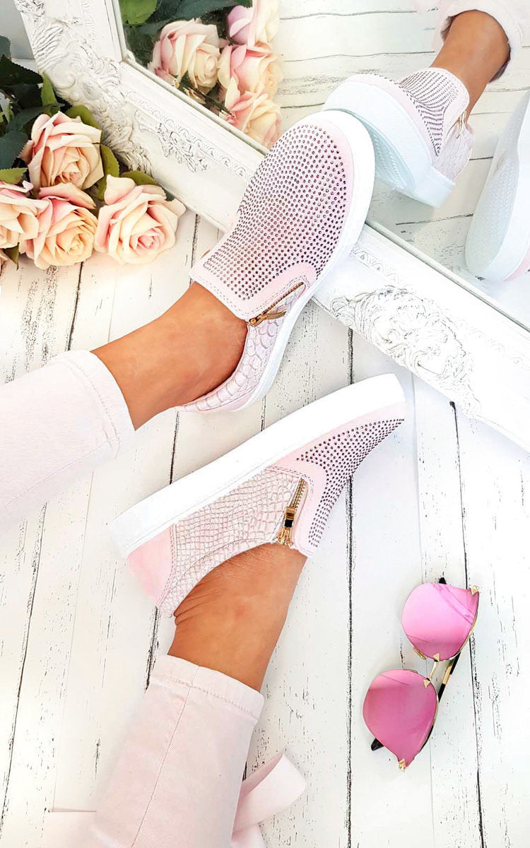 Pink slip-on trainers with diamante front and croc-effect side panels, gold zip trim.